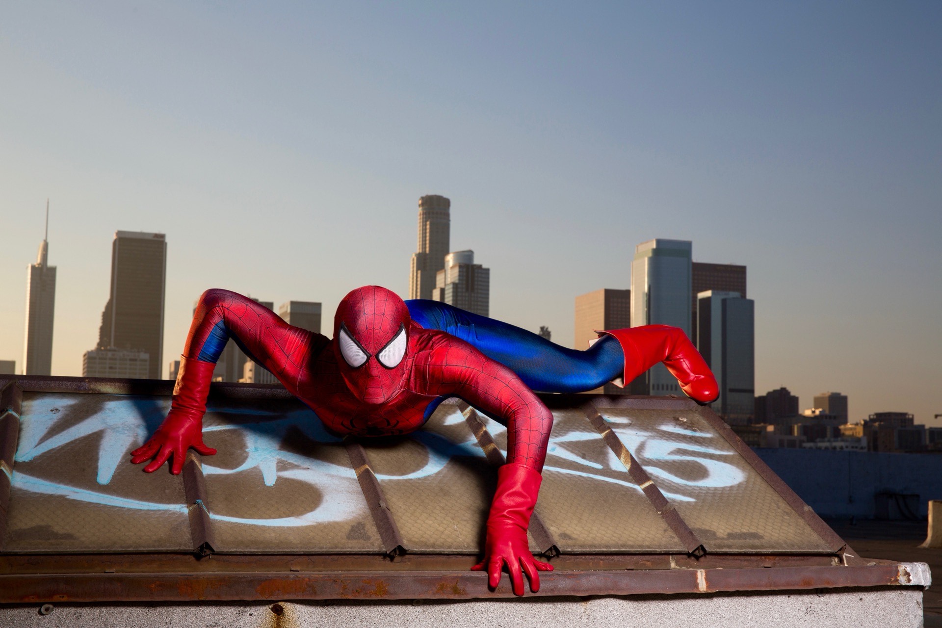 Spider-Man superhero character entertaining students at a school event