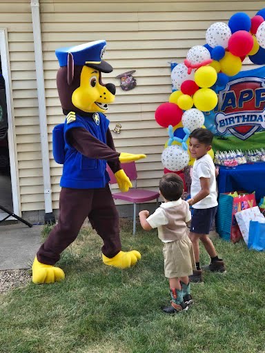 Skye and Chase from PAW Patrol at a summer backyard birthday party in Chicago